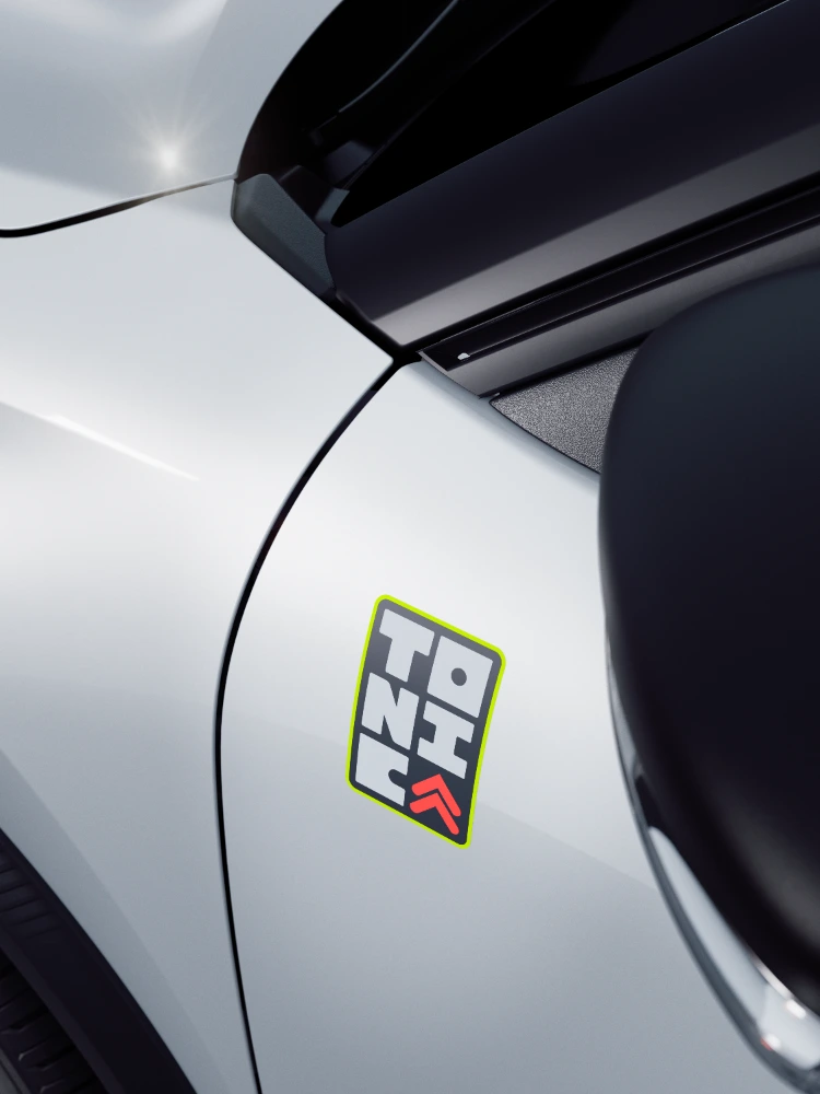 Detailansicht Front des Citroën ë-C3 TONIC Limited Edition Elektro-Stadtauto mit markantem Kühlergrill und Color Clips, unverwechselbare E-Fahrzeug Alternative